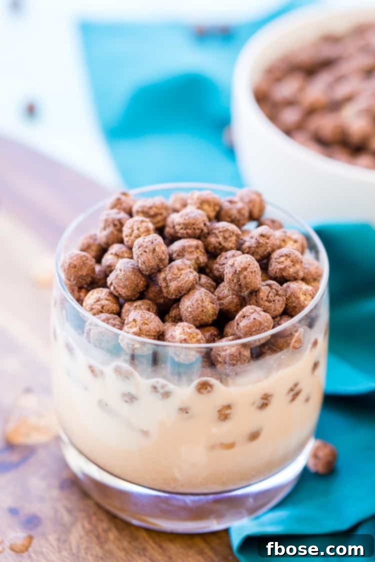 A perfectly layered Cocoa Puffs White Russian, showcasing the distinct layers before mixing.