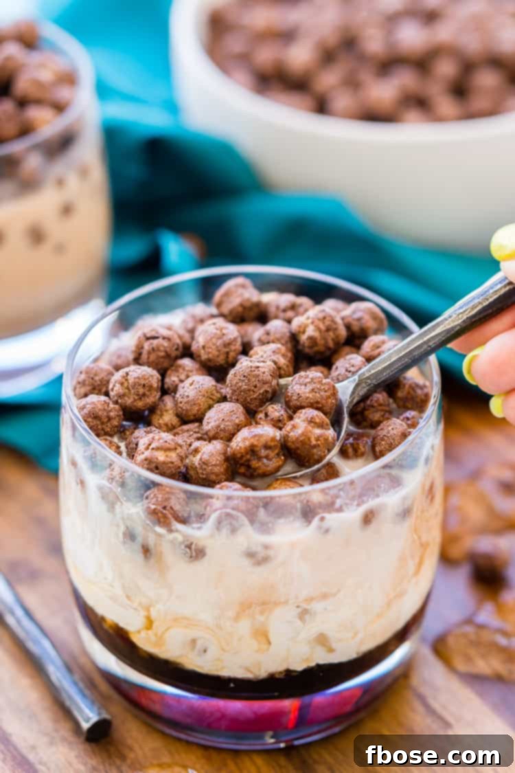 A vibrant Cocoa Puffs White Russian, adorned with chocolate cereal, presented as a chic and fun cocktail.
