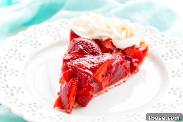 Pink Cloud Strawberry Pie 5 A whole Strawberry Jello Pie cooling on a wire rack, showing the set jello and strawberry filling.