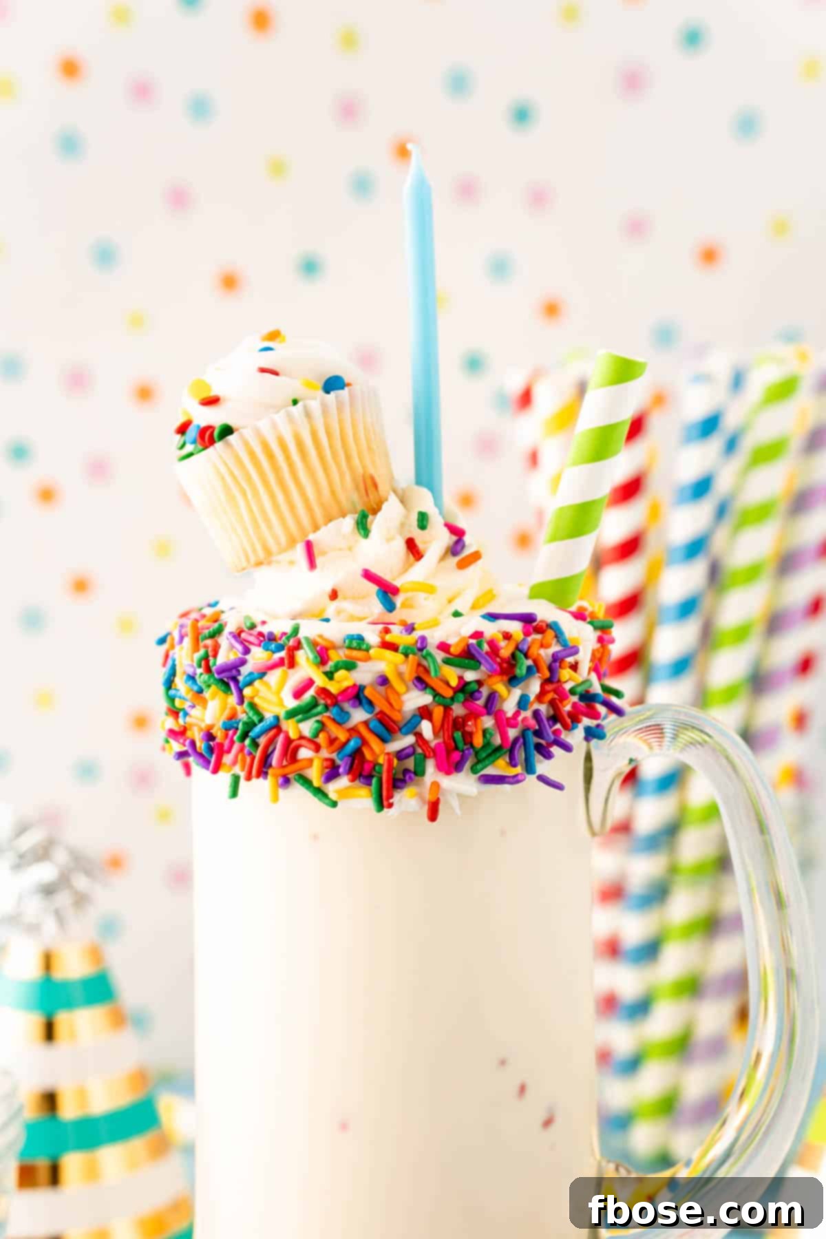 Close-up of a birthday cake milkshake, showcasing its creamy texture and sprinkles.