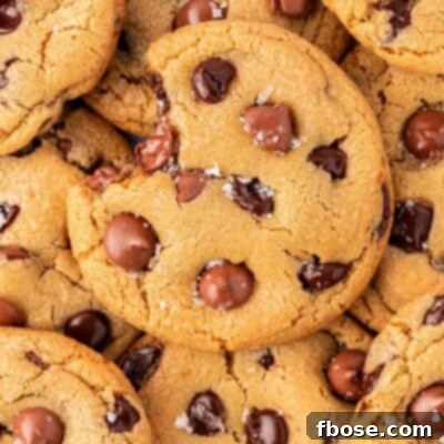 Close up of a plate of chocolate chip cookies with sea salt on them.