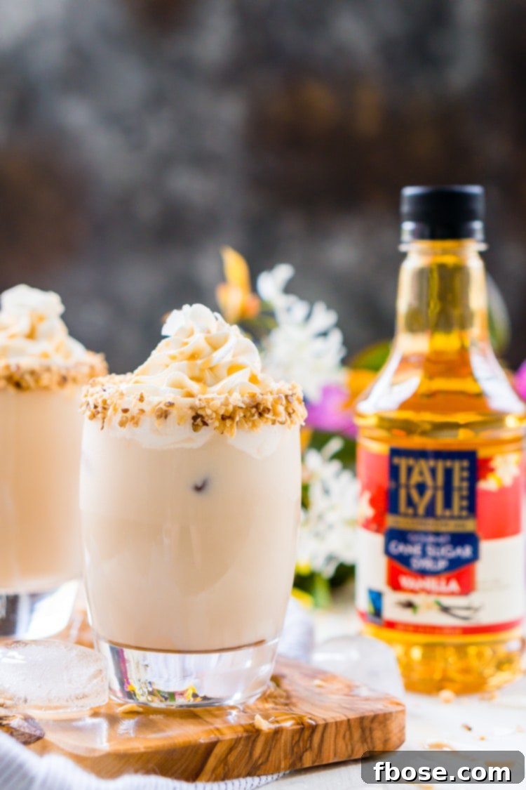 A table setting with two German Chocolate Cocktails, perfect for an evening dessert, highlighting the drink's rich appeal and ideal serving suggestion.
