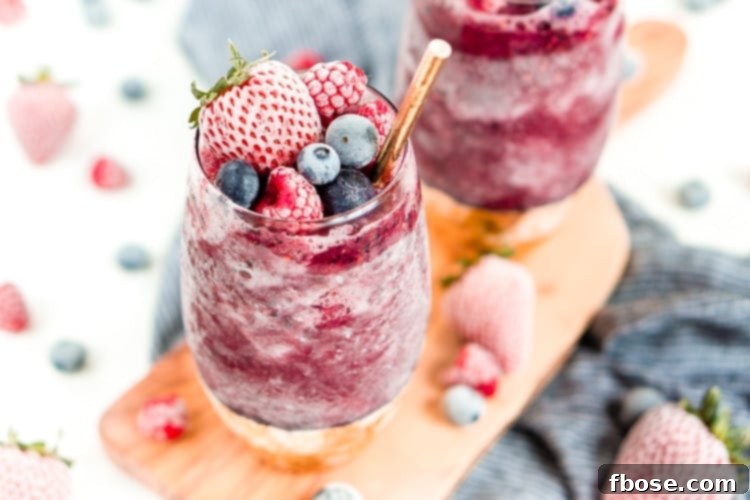 Sangria Slushies are loaded with berry and citrus flavors and Red Moscato making it the perfect frozen cocktail for summer!