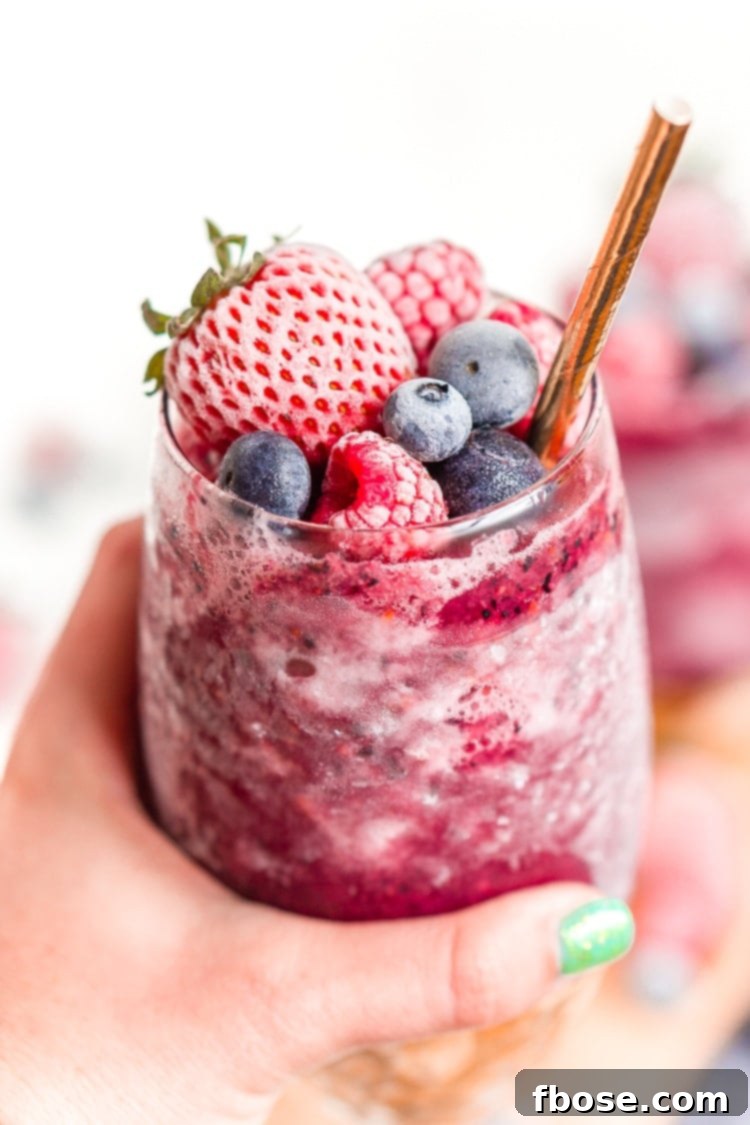 Sangria Slushies are loaded with berry and citrus flavors and Red Moscato making it the perfect frozen cocktail for summer!
