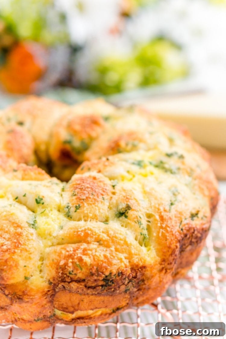 Delicious Garlic Parmesan Monkey Bread, a perfect savory side for brunch or dinner, featuring golden-brown, cheesy pull-apart sections.