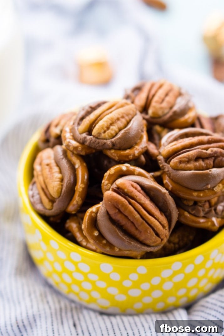 Assortment of Pretzel Turtles in a gift box with baker's twine, ready for gifting. Each candy features a mini pretzel, a Rolo, and a pecan.