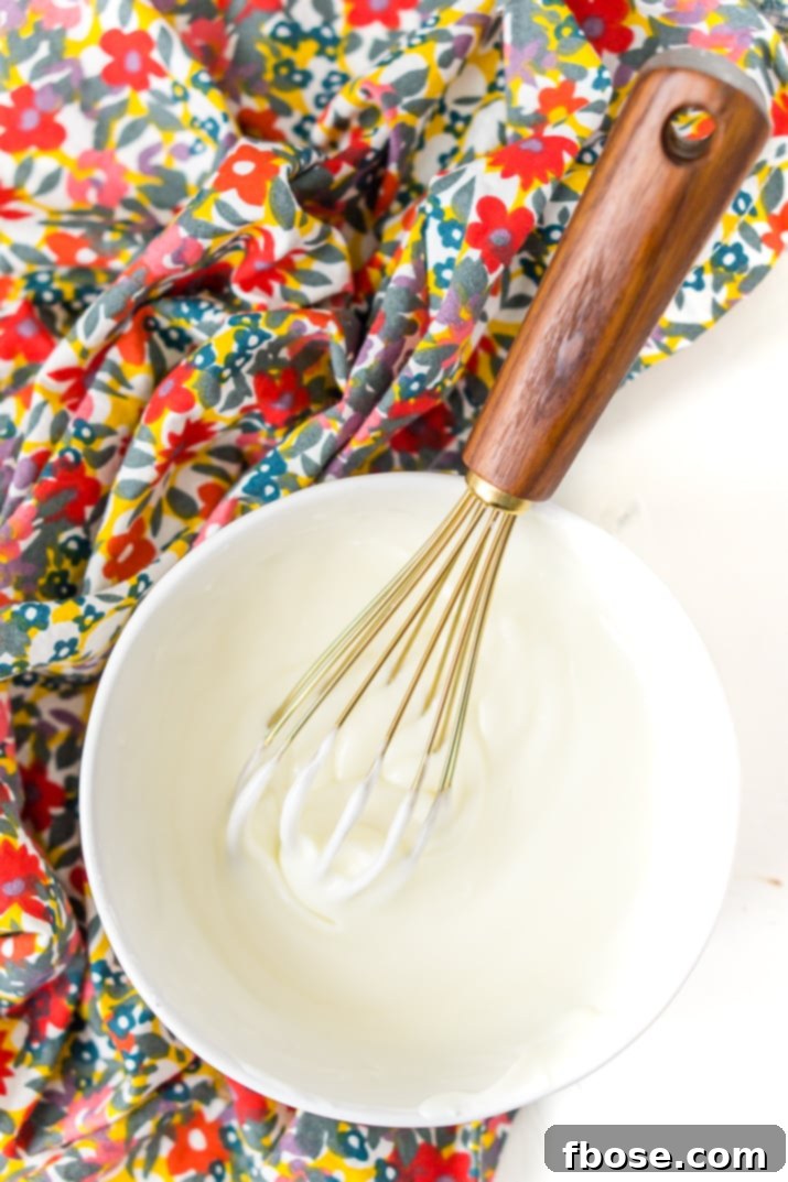 This really is the best homemade vanilla icing recipe! It's perfect for slathering on cinnamon rolls and drizzling over cakes and cookies!