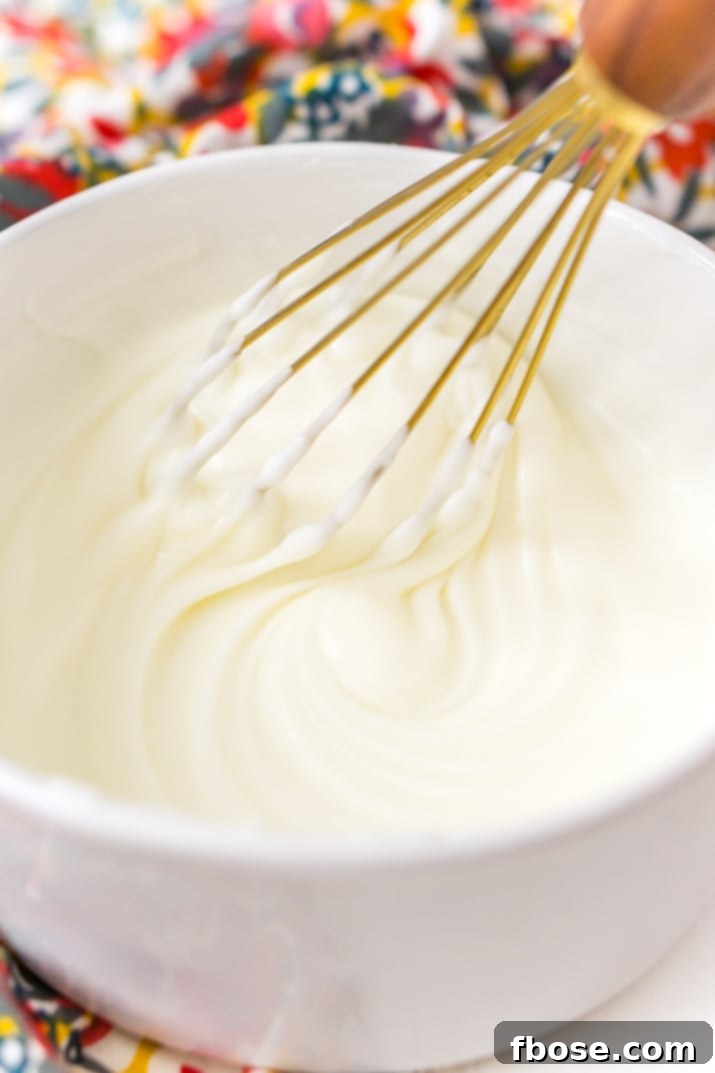This really is the best homemade vanilla icing recipe! It's perfect for slathering on cinnamon rolls and drizzling over cakes and cookies!