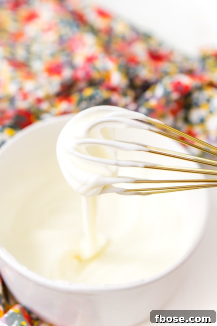 This really is the best homemade vanilla icing recipe! It's perfect for slathering on cinnamon rolls and drizzling over cakes and cookies!