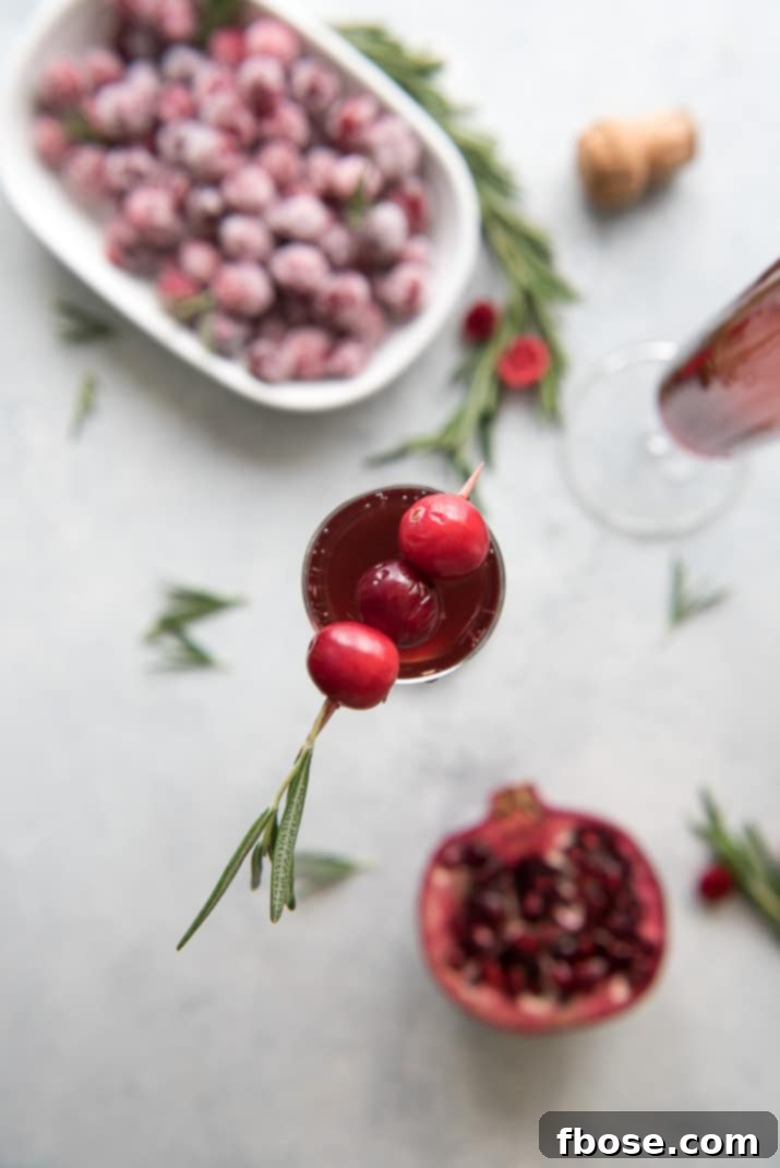 This pretty Cranberry Pomegranate Champagne Cocktail will fit right in during all your holiday festivities, but is versatile enough to be enjoyed any time of the year!