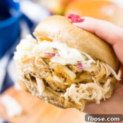 Homemade Apple Cider Pulled Chicken served on a bun