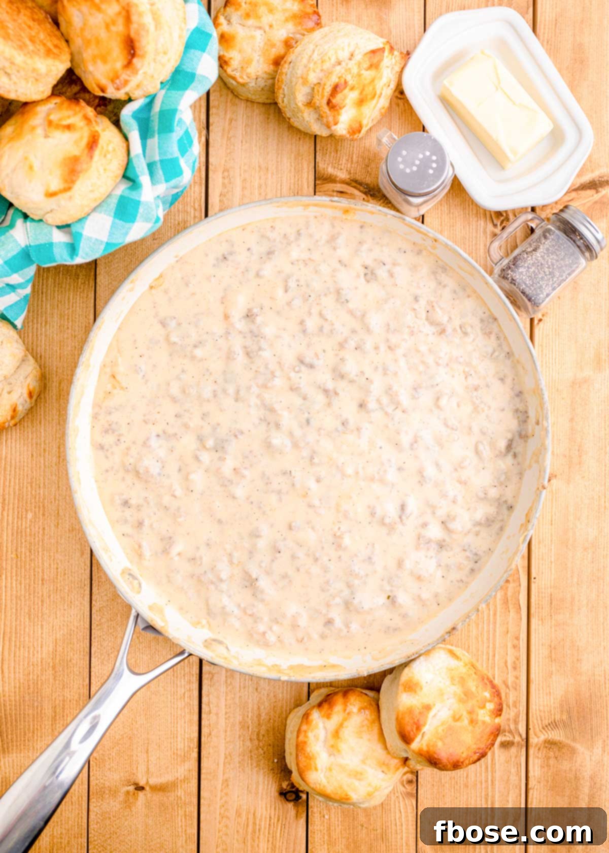Overhead photo of a large skillet filled with creamy, perfectly cooked sausage gravy, ready to be served.