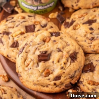 Decadent Chunky Monkey Pudding Cookies 13 Chunky Monkey Pudding Cookies on a wooden board.