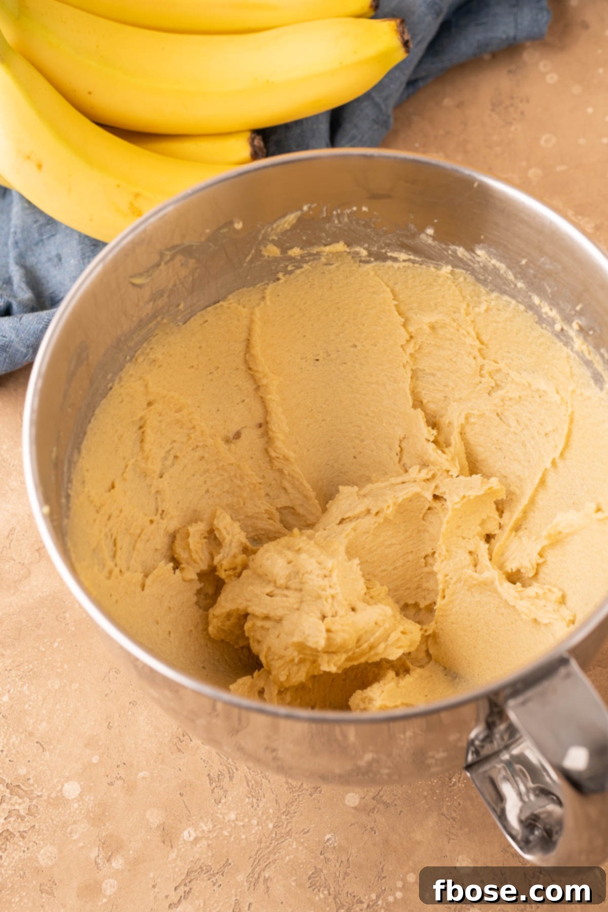 Decadent Chunky Monkey Pudding Cookies 5 Butter and sugar that's been creamed in a stand mixer bowl.
