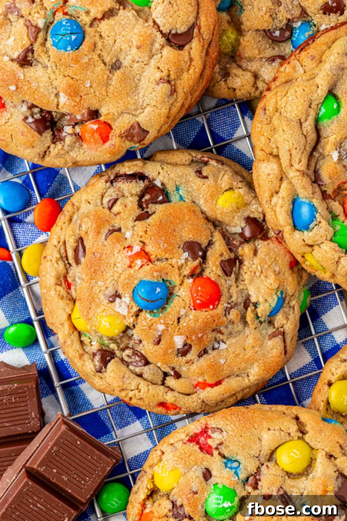 Overhead photo of NYC style monster cookies on a wire rack.