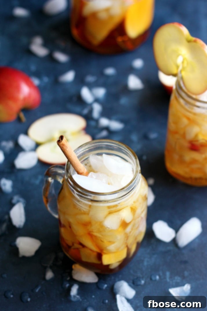 Refreshing Apple Pimm's Cup with apple slices and a hint of lemon