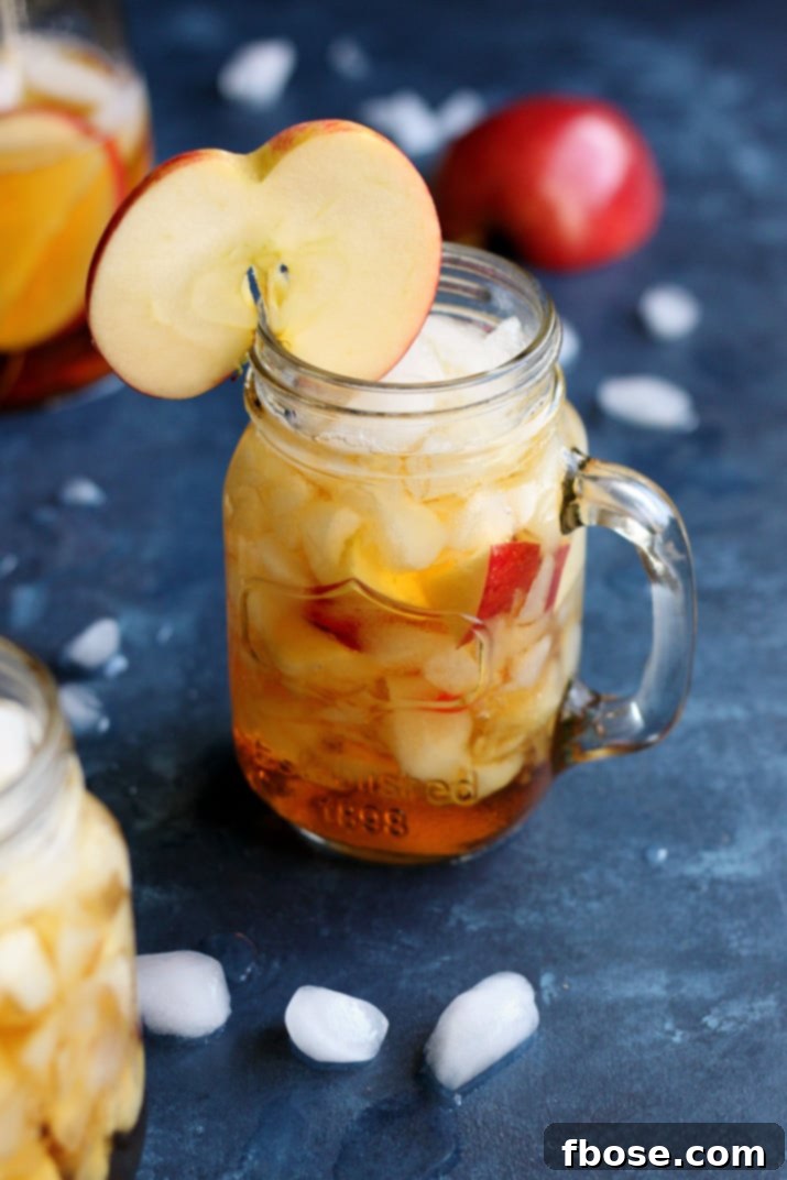 Close-up of Apple Pimm's Cup with detailed apple slices and ice
