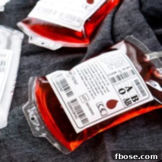 A chilling Blood Bag Cocktail, perfect for adding a spooky touch to any Halloween celebration. This two-ingredient drink is both easy to make and deliciously sinister!