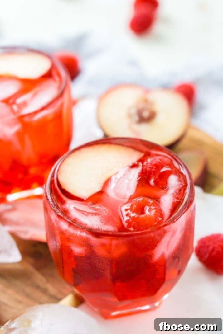 Cherry Red Russian Cocktail in elegant glassware with garnishes