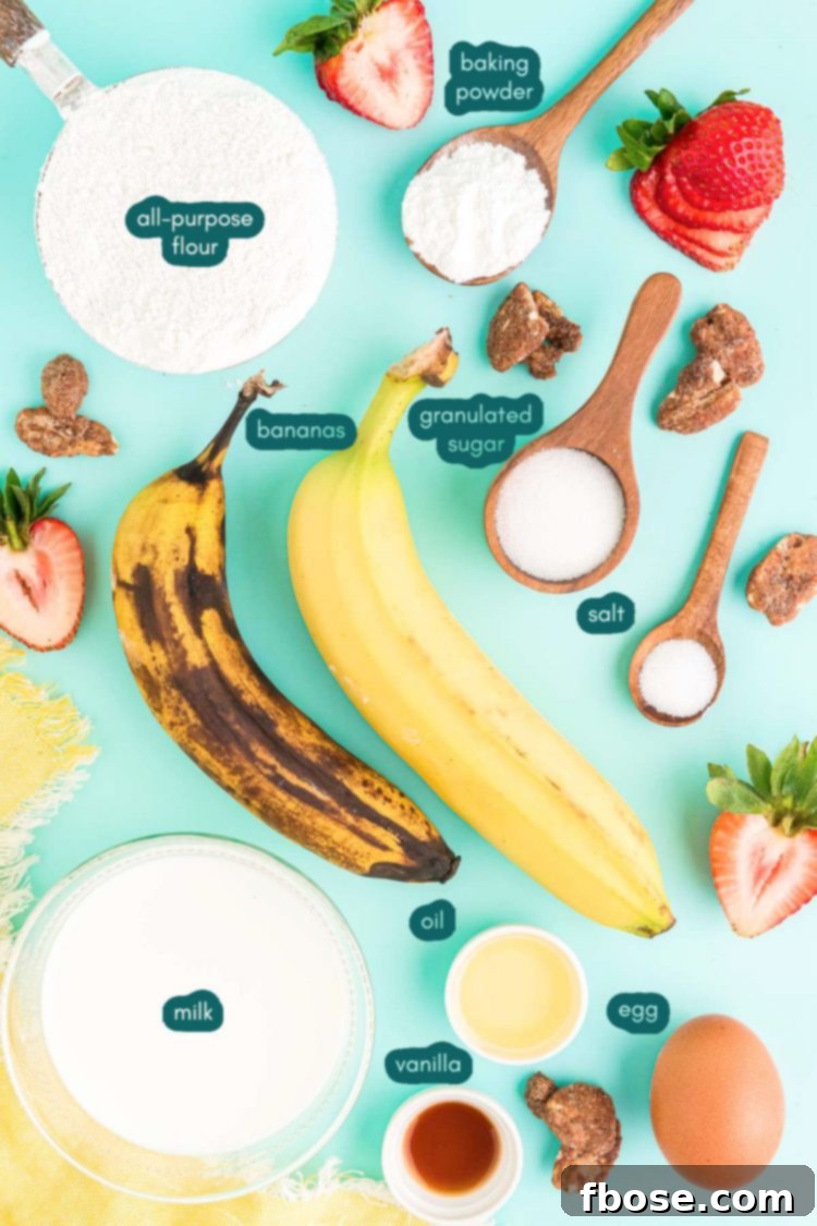 Overhead shot of all the dry and wet ingredients for banana pancakes laid out on a teal kitchen surface, ready for mixing.