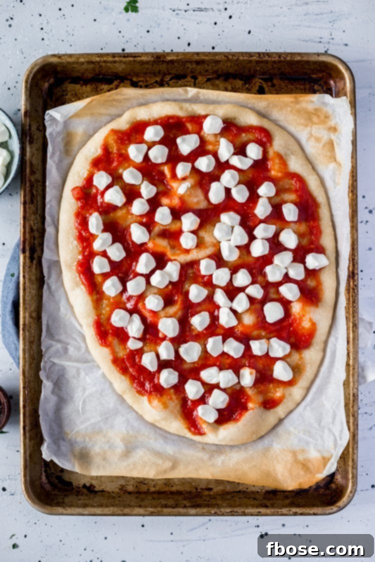 Authentic Margherita Masterpiece 5 Sauce and mozzarella on Margherita Pizza