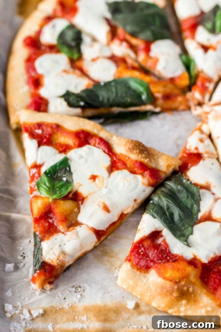 Authentic Margherita Masterpiece 8 A Classic Margherita Pizza made with delicious dough, olive oil, crushed tomatoes, garlic, mozzarella, and basil always hits the spot when you need a quick and easy dinner recipe!