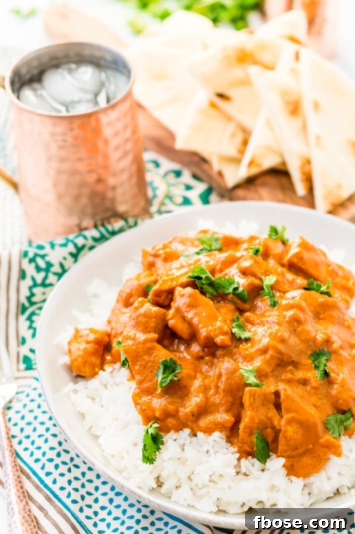 Homemade Chicken Tikka Masala cooking on stovetop