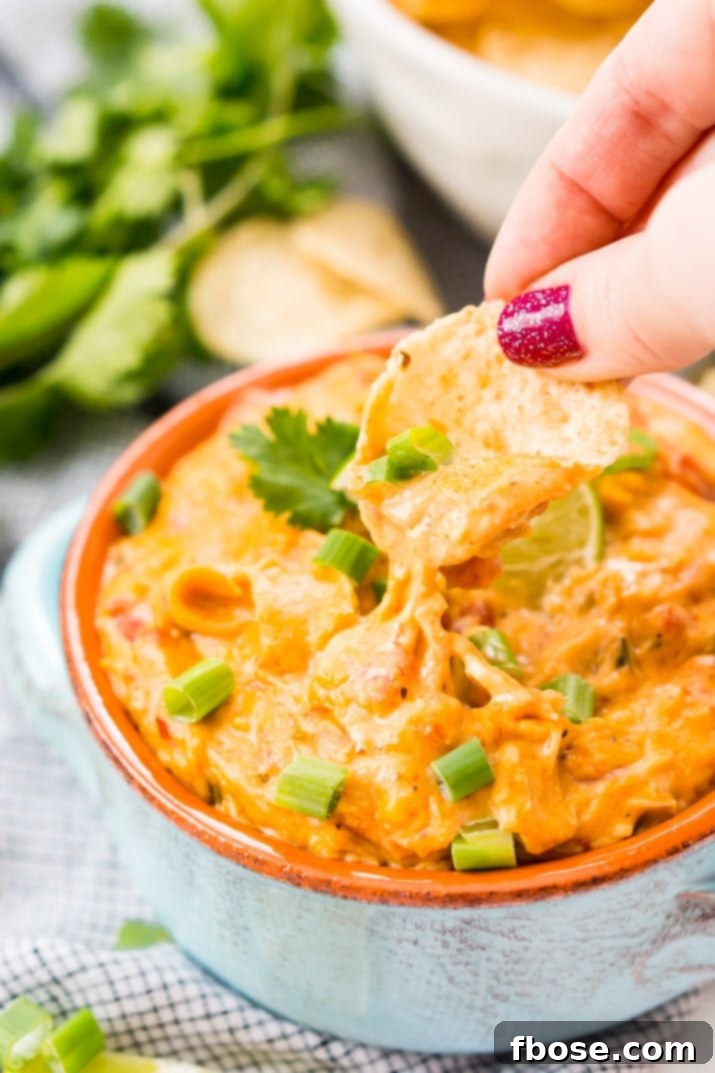 Easy and delicious chicken queso dip recipe made in a slow cooker!