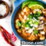 This Slow Cooker Posole (or Pozole) is a traditional Mexican stew made with hominy and pork and a flavorful broth that's super easy to make!