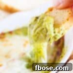 This Baked Spinach Artichoke Dip is a must have at any party. With two different prep methods, you can make it either hearty or creamy!