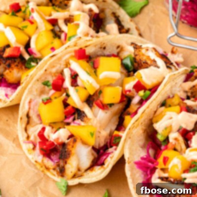 Blackened cod tacos on a piece of parchment paper.