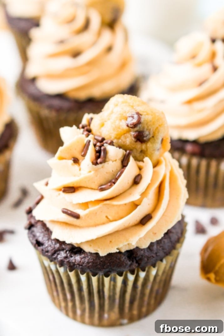 Cookie Dough Stuffed Peanut Butter Chocolate Cupcakes 2 These Cookie Dough Cupcakes are made by stuffing an edible cookie dough into moist chocolate cupcakes and then topping it with a velvety peanut butter frosting, sprinkles, and a mini chocolate chip cookie!