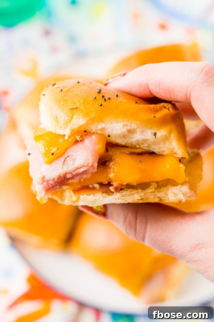 A freshly baked pan of Ham and Cheese Sliders, golden brown and ready to be pulled apart.