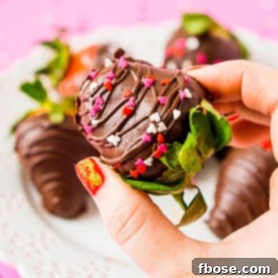 The best homemade chocolate covered strawberries recipe for special occasions. Features fresh fruit dipped in smooth chocolate that won't crack.