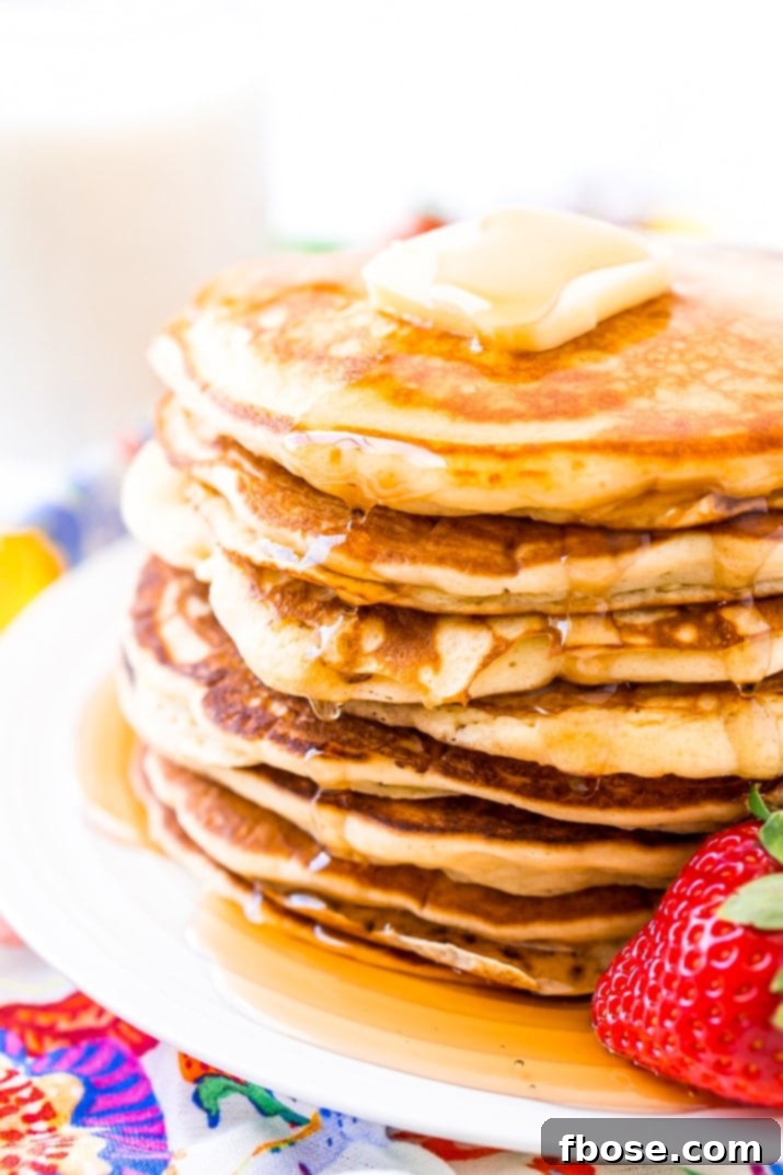 Buttermilk Pancakes on White Plate, perfectly golden and stacked
