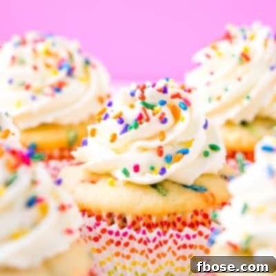 These Birthday Cupcakes are a delicious and fluffy vanilla almond cake that's loaded with sprinkles and topped with an easy and addictive whipped frosting!