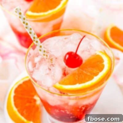 This Shirley Temple drink is a classic and nostalgic mocktail recipe made with homemade grenadine, ginger ale, ice, and an orange slice!
