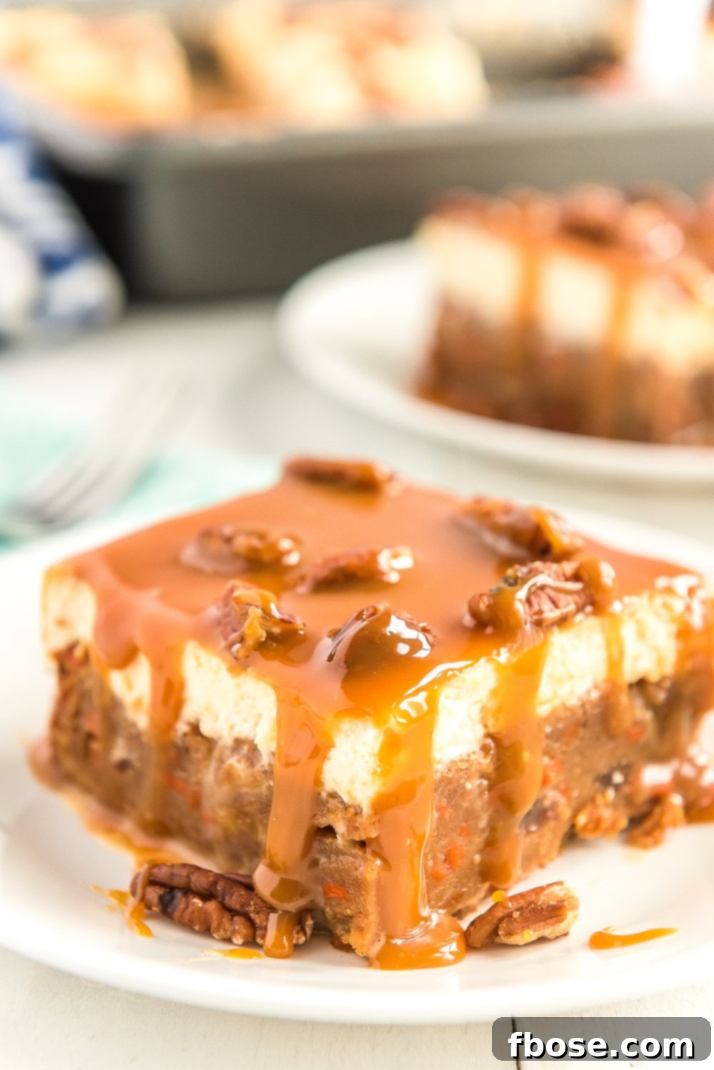 Slice of Caramel Carrot Cake on white plate.