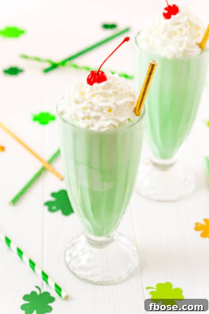 This Shamrock Shake is a McDonald's Copycat recipe that tastes just like the real thing! A thick and sweet vanilla mint shake for St. Patrick's Day!