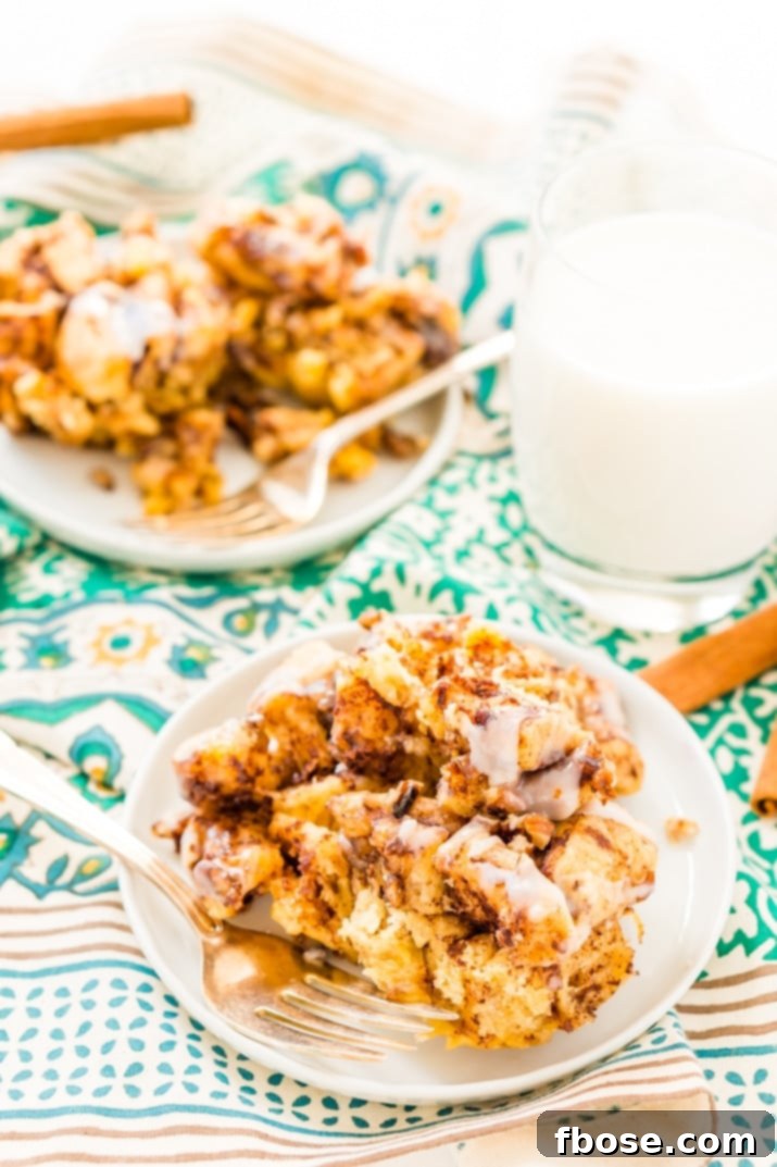 Cinnamon Roll Casserole on plates with fork and milk
