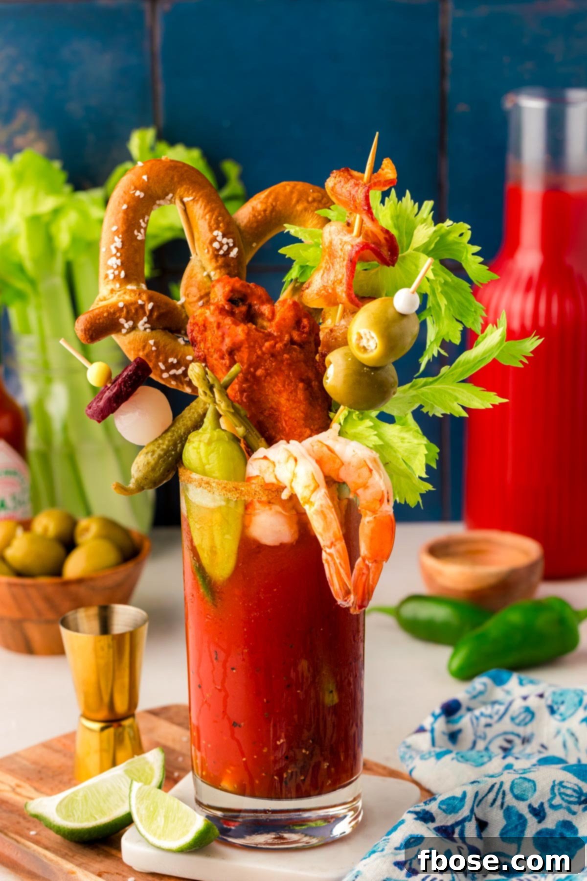 This is the Best Bloody Mary recipe made with vodka, tomato juice, spices, hot sauce, Worcestershire sauce and other delicious ingredients! Perfect for weekend mornings and brunch with friends! A Bloody Mary with an elaborate skewer of savory garnishes, including bacon, olives, and pickles, for a decadent presentation.