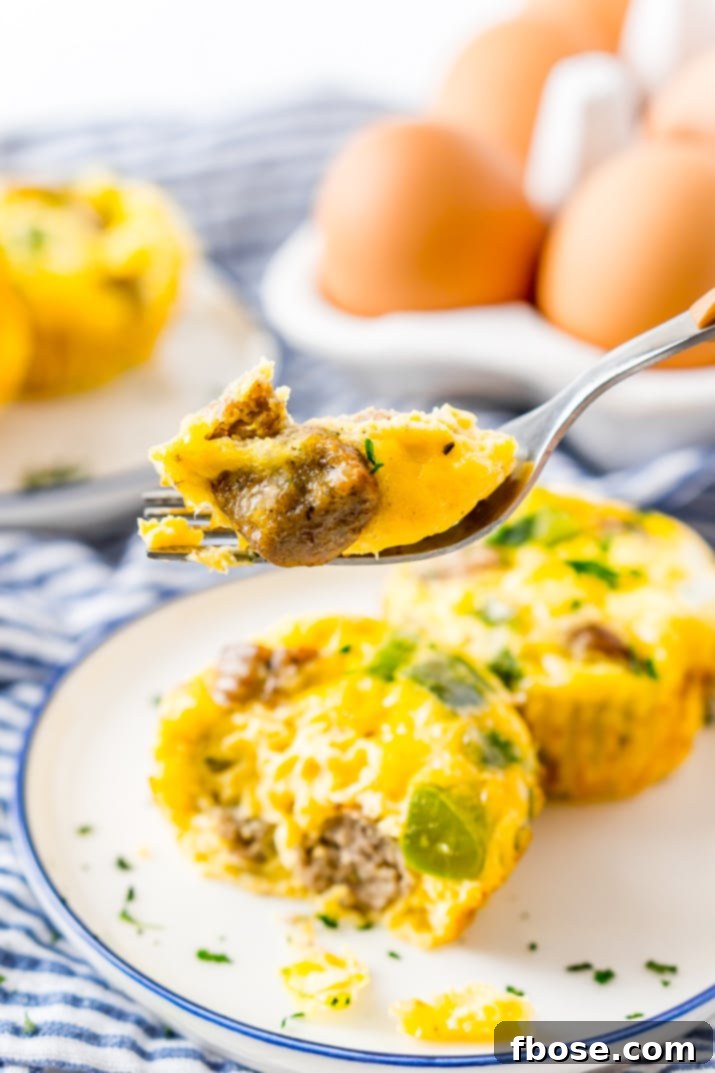A vibrant selection of fresh ingredients including eggs, green peppers, sausage, and cheese, ready to be transformed into Crustless Mini Quiches.