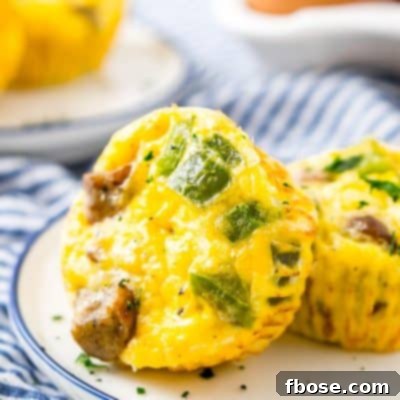 Close up photo of two mini quiche on a plate.