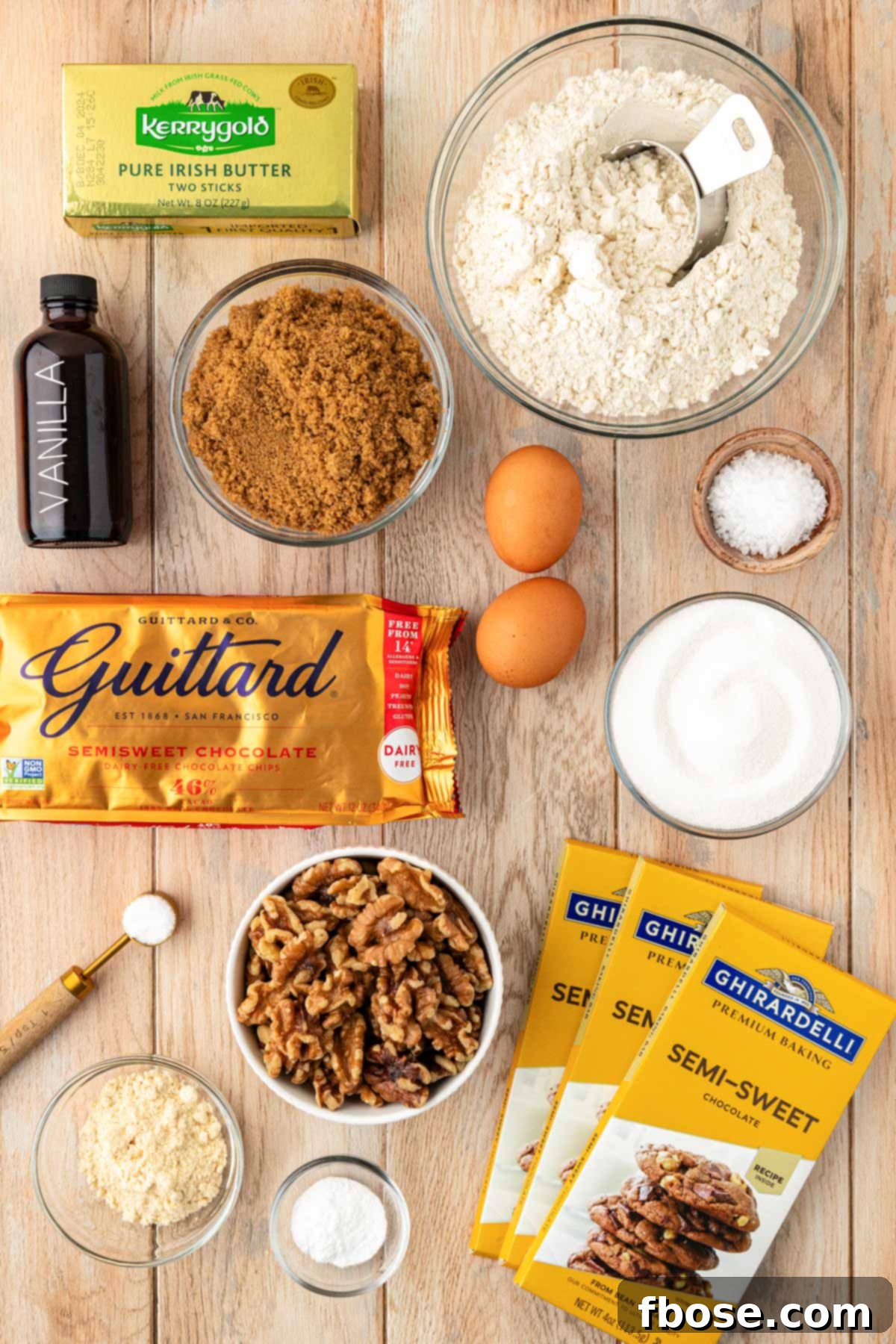 The Definitive Chocolate Chip Cookie 3 Overhead photo of ingredients on a wooden table to make chocolate chip cookies.