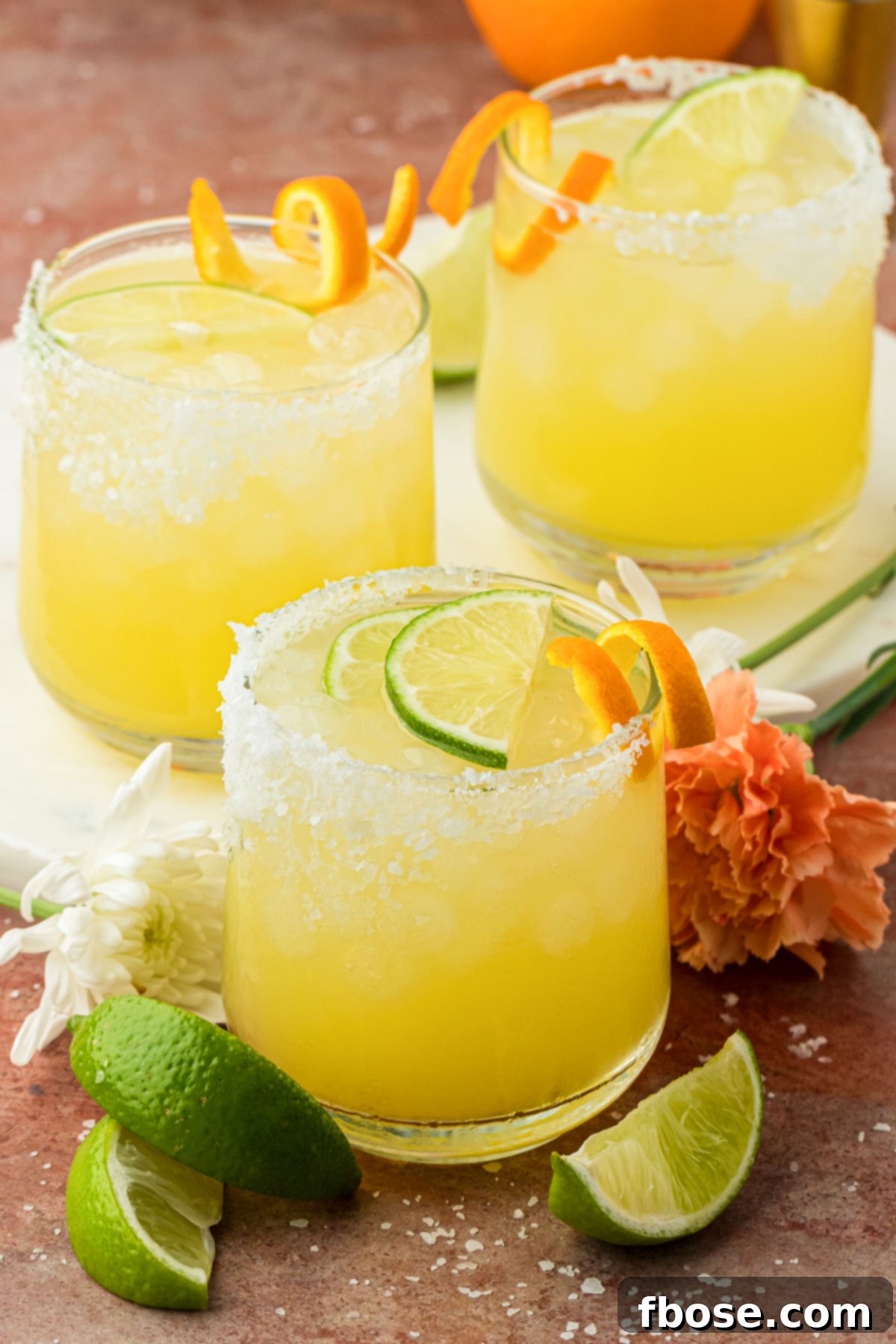 Three skinny margaritas on a table.