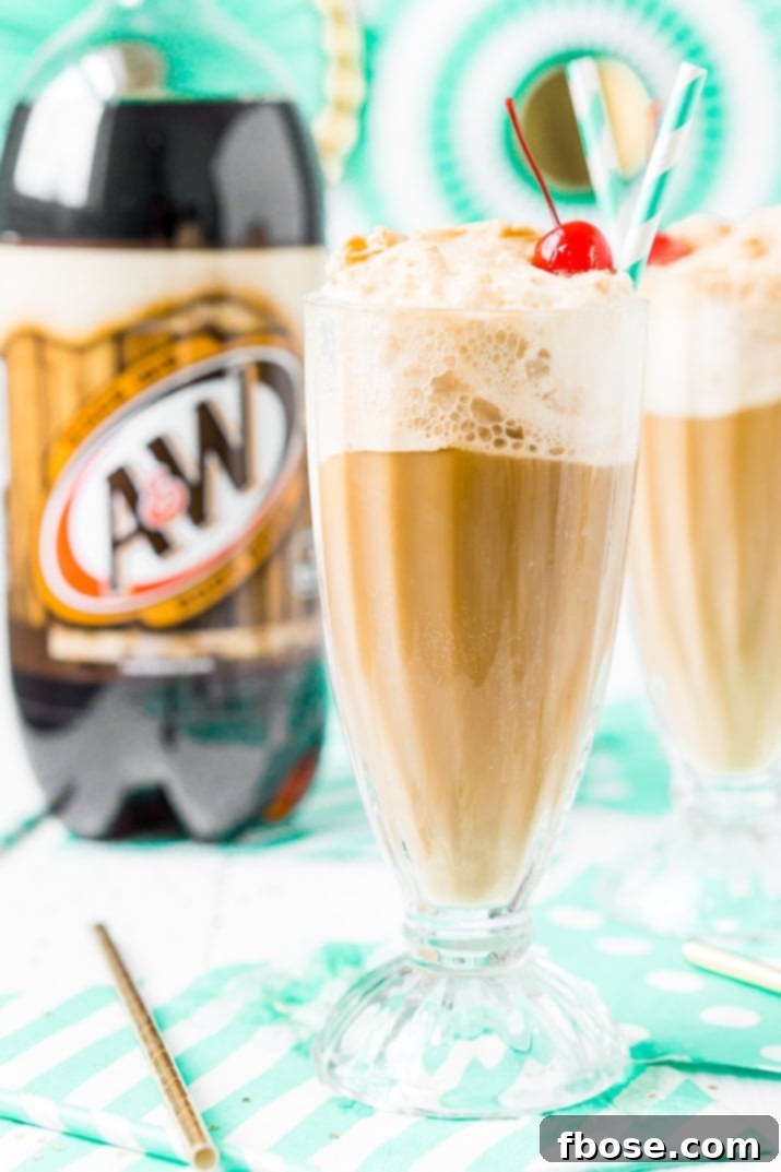Two perfectly crafted A&W Root Beer Floats in tall glasses, with the iconic A&W root beer bottle in the background, showcasing the creamy foam and vibrant color.