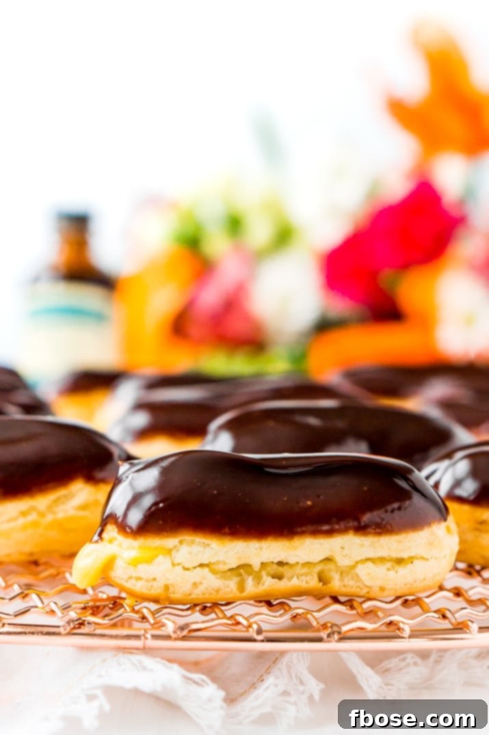 The Eclair is a classic French pastry traditionally made with choux dough, pastry cream filling, and dipped in a rich chocolate glaze. They're a fancy dessert that's easy to make at home!