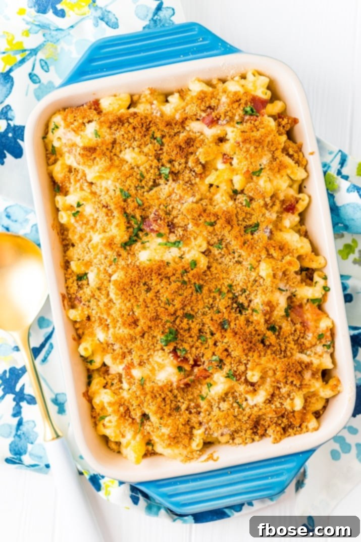 Loaded Bacon Triple Cheese Mac 6 This Three Cheese Bacon Mac and Cheese is loaded up with crispy baked bacon and three different kinds of cheese, it's to die for!