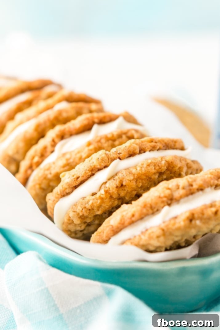 These Oatmeal Cream Pies are soft and chewy just like the ones you grew up with. Sweet oatmeal cookies sandwich a creamy vanilla filling for an easy and delicious dessert!
