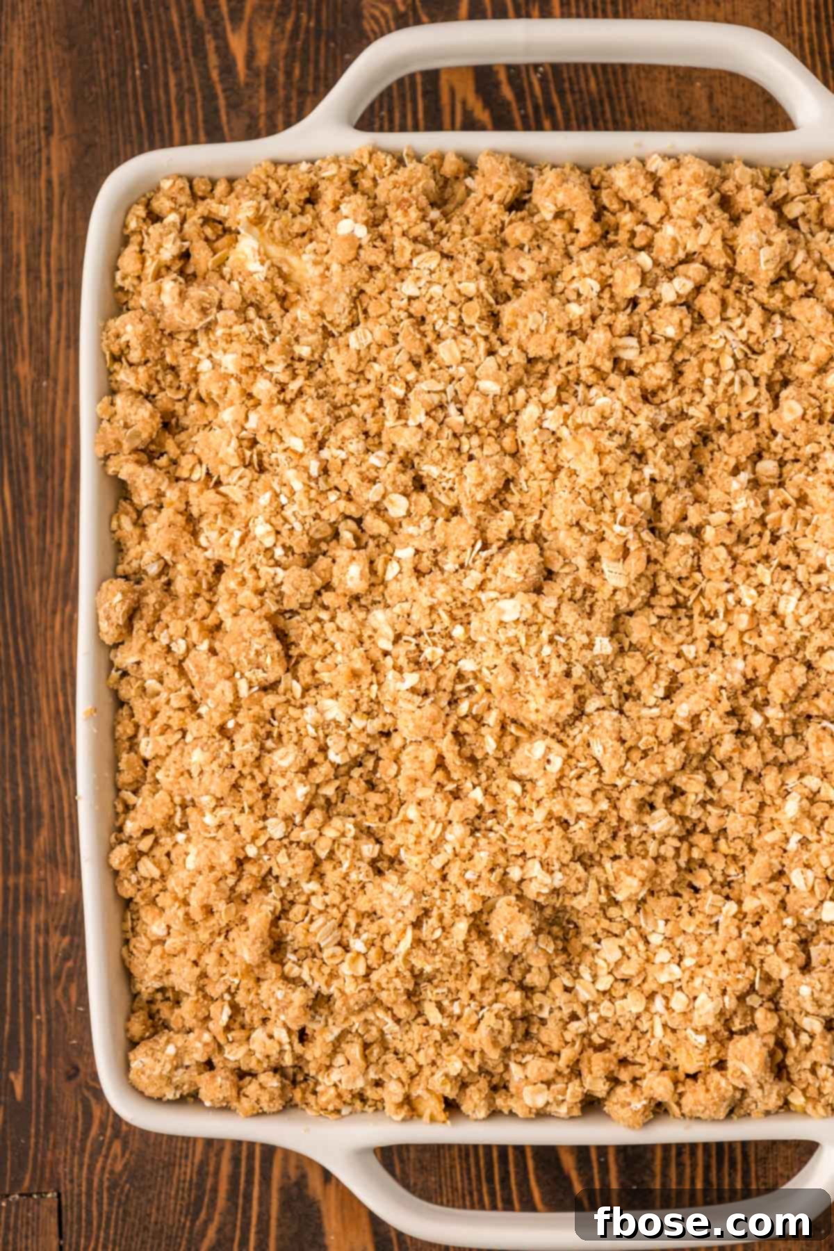 Comforting Apple Oat Crumble 6 Apple crisp in a baking dish ready to bake.